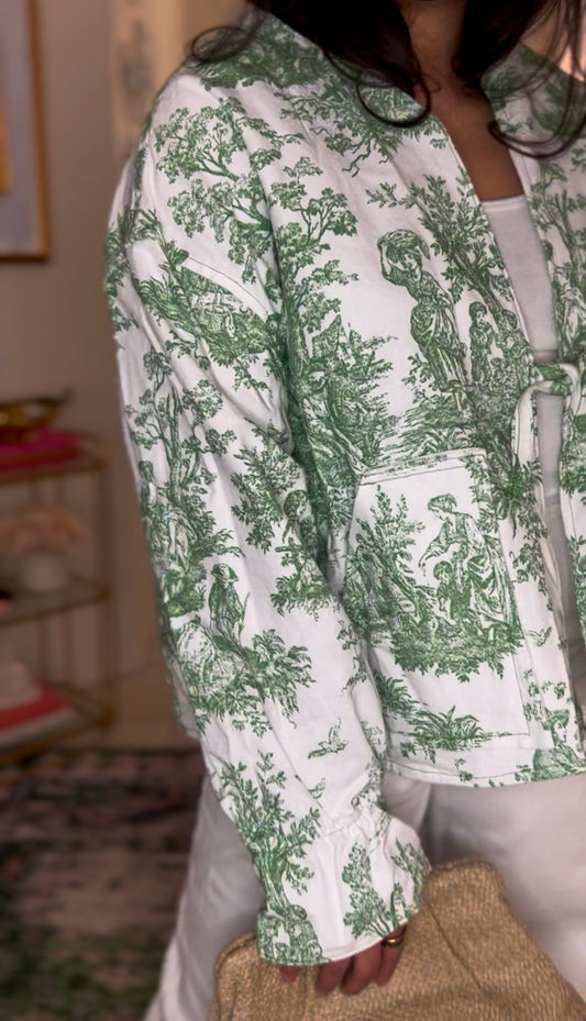 Handmade lightweight jacket featuring vintage green toile print on white cotton. This one of a kind piece is crafted from rescued deadstock fabric, combining preppy elegance with southern charm- made in the USA.