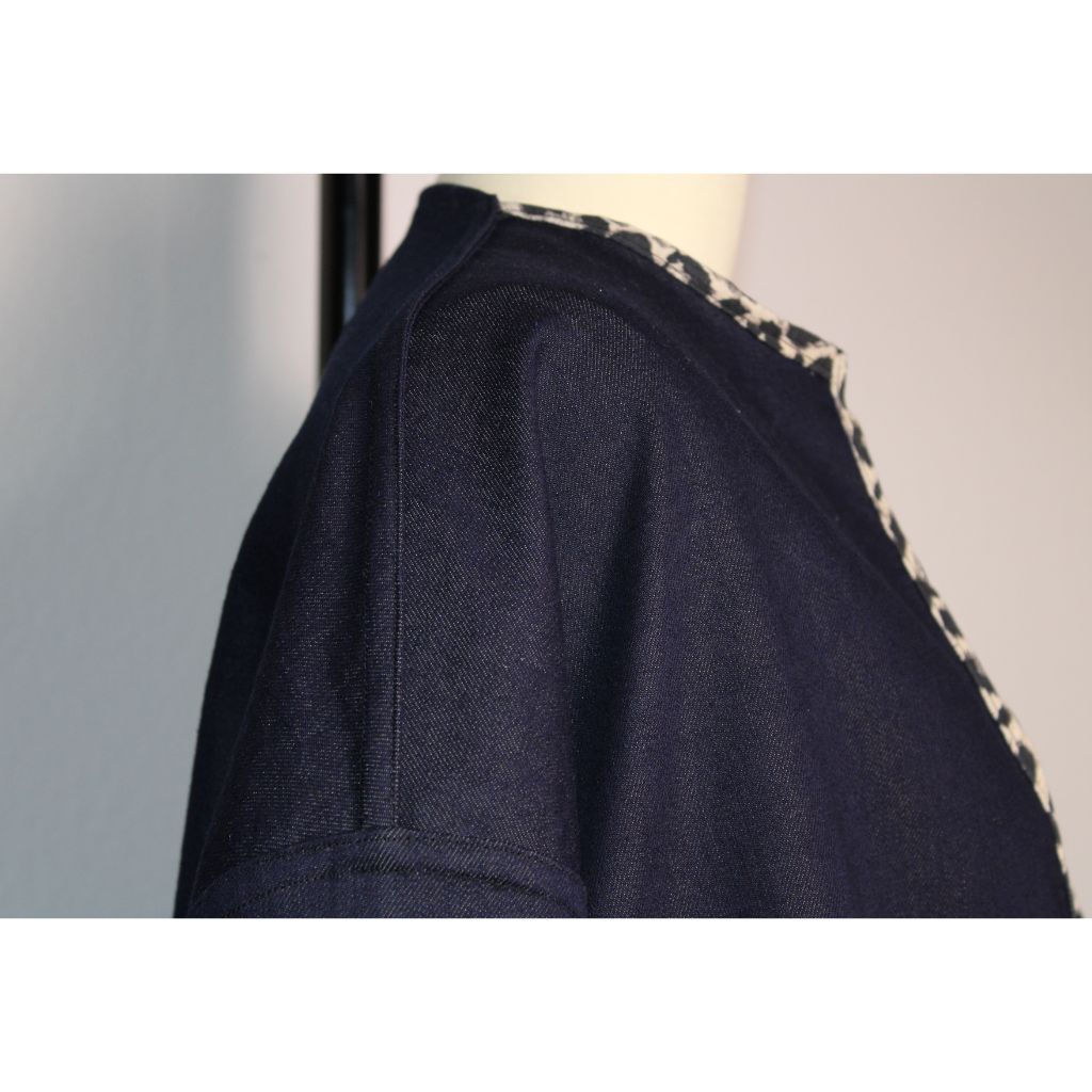 Handmade dark denim jacket with bold leopard print trim along the collar, cuffs, pockets, and hem. Featured oversized front patch pockets and relaxed, unlined silhouette. Ethically made in the USA from upcycled deadstock fabric- a funky twist on a timeless layering piece. 