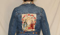 Handmade denim jacket featuring a vintage Catholic sewn into the center, repurposed from deadstock denim and designed for bold, sustainable streetwear. 