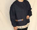Handmade dark blue denim jacket featuring a large vintage horse illustration on the back and a hem trimmed with printed fabric showing a galloping horse motif. Western inspired tan accents and a denim panel across the front. One-of-a-kind ethically sewn from rescued textiles.
