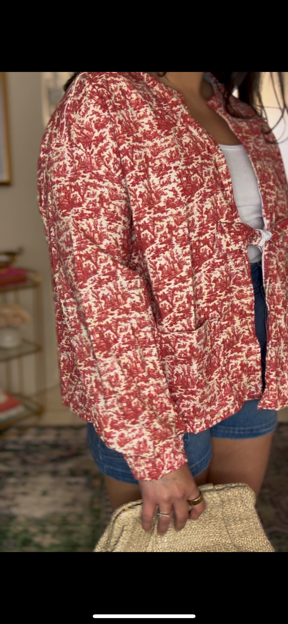 Handmade jacket featuring a red miniature toile de Jouy print on a soft cotton. Designed with roomy front pockets and an open front, and a subtle waist tie for easy layering. Ethically made in the USA from upcycled deadstock fabric. Classic with a playful twist-pairs perfectly with denim or dresses. 