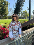 One of a kind handmade jacket crafted from upcycled floral and ticking stripe cotton. Featured romantic rose print panels, vintage inspired playful cottage core silhouette. Ethically made from deadstock fabric and sewn in the USA. 